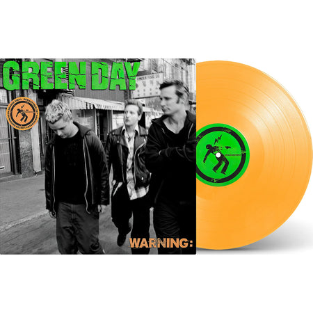Green Day Warning 25th Anniversary orange vinyl LP packshot displaying orange record and jacket together