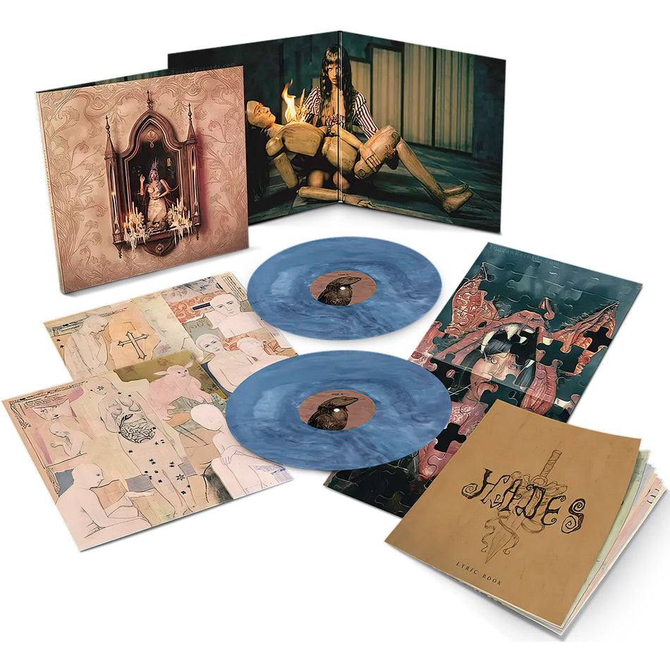 Melanie Martinez HADES 2LP vinyl packshot. Indie Exclusive Aura Blue colored vinyl, gatefold, 20 page booklet, random poster, art pop music from the Cry Baby superstar