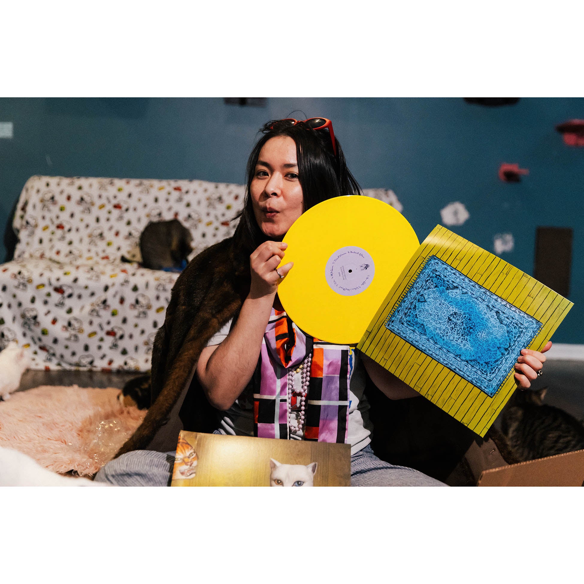 Mitski opens her pretty tansy yellow indie exclusive of Nothing's About To Happen To Me