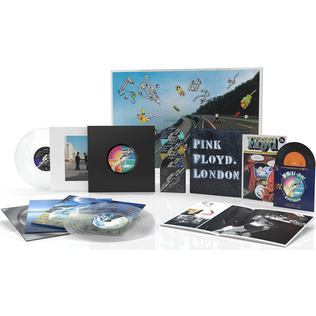 Pink Floyd Wish You Were Here 50th Anniversary packshot with 4 clear vinyl LPs, Blu-ray, 2 CDs, 7-inch Japanese Replica Vinyl Single, hard cover book, and poster. Rare unreleased tracks included.