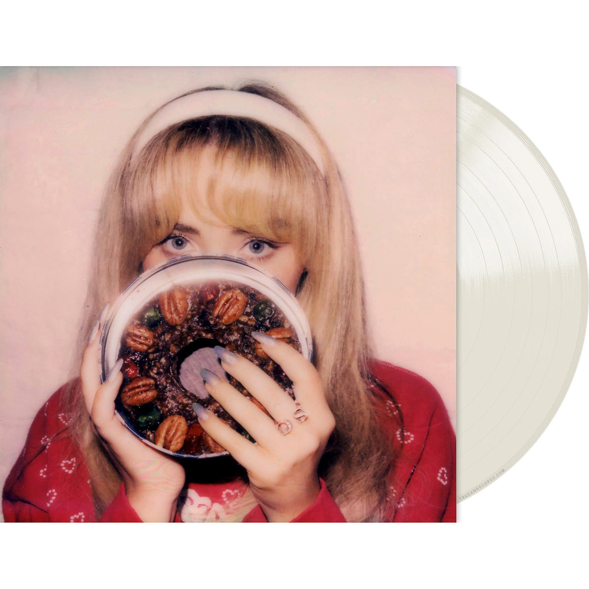 Sabrina Carpenter Fruitcake milky clear vinyl EP packshot with single-pocket jacket and a playful six-song holiday tracklist