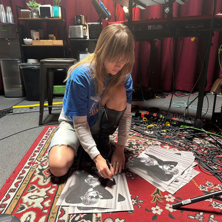 Suki Waterhouse - Loveland showing Suki Waterhouse signing album insert artwork. The record is pressed on pink indie exclusive vinyl and housed in a gatefold jacket.