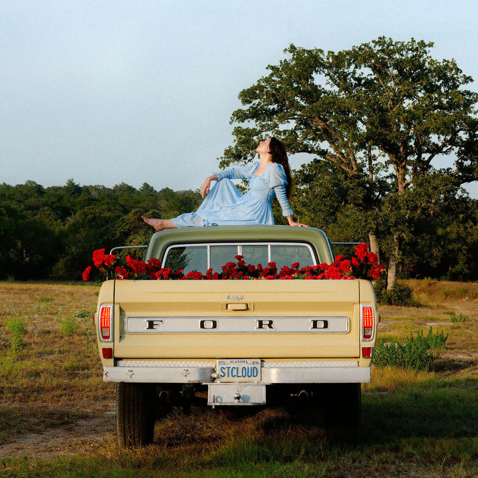Waxahatchee Saint Cloud album cover, Katie Crutchfield Americana album on vinyl. A yellow FORD pickup truck with red roses in the bed